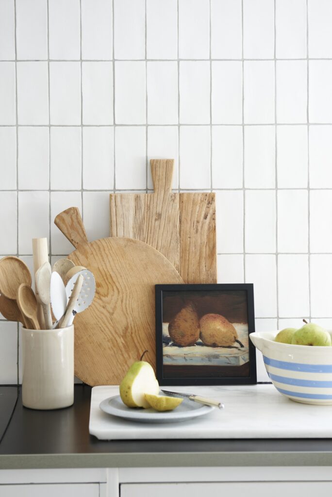 kitchen with chopping board and vintage oil painting