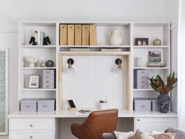 wide shot of home office desk with brown chair and hutch storage space