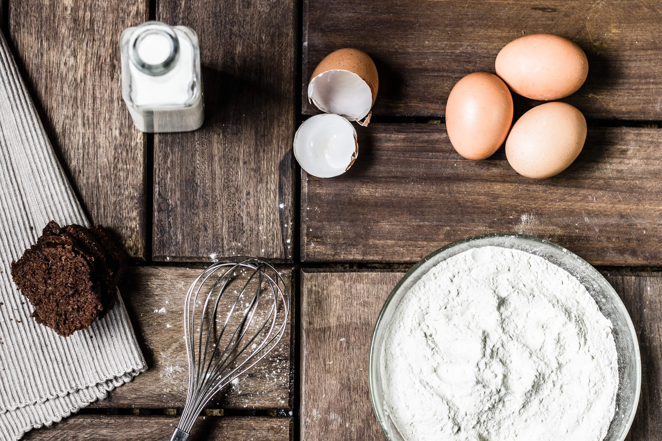 Cake ingredients on a wooden table