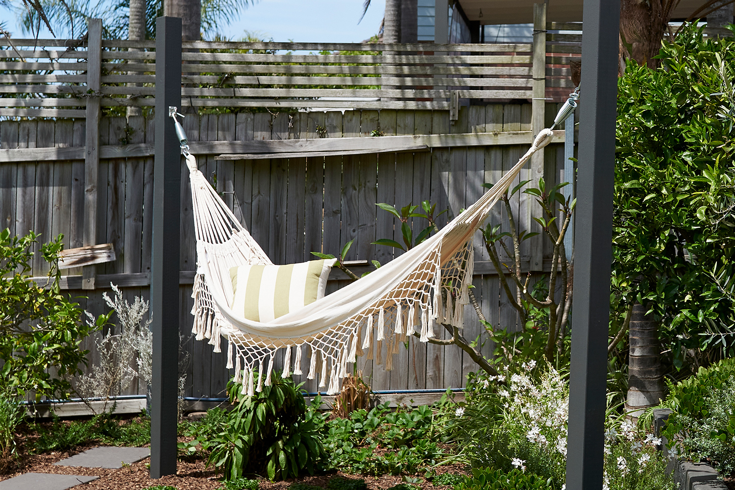 How to hang a hammock with posts | Better Homes and Gardens